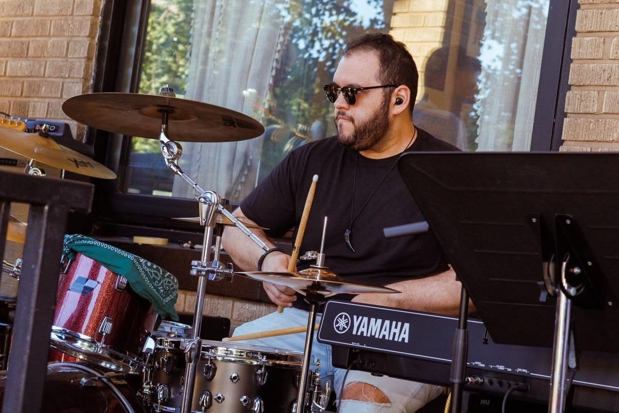 Peter Rodriguez performing on drums